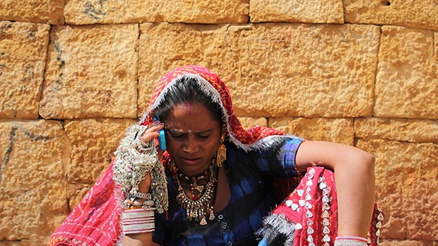 Indian merchant uses mobile phone 