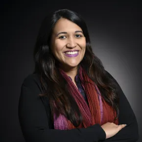 headshot of woman in dark jacket