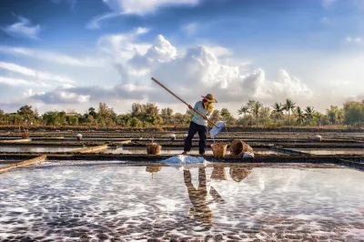 Men work in a salt flat