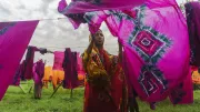 A woman hangs out clothes on a line