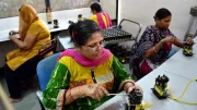 Women work in an assembly line in India