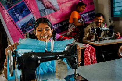 A group of people in India using sewing machines
