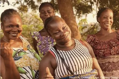 A group of four rural women smiling