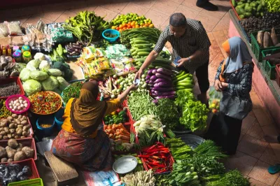 farmer selling produce at a street market