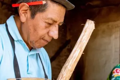 A carpenter working with wood