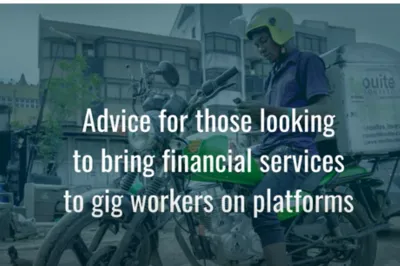 man on bike looking at his phone