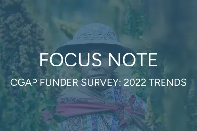 an indigenous woman from Peru standing in her field in colorful clothing