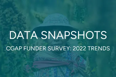 an indigenous woman from Peru standing in her field in colorful clothing