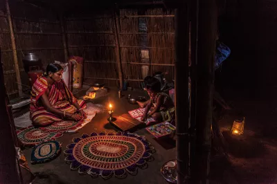 a woman and a child in a candlelit stitching embroidery 