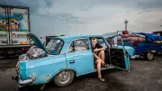A young man sell vegetables out of his car in Ukraine