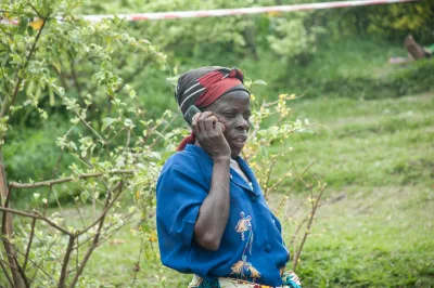 A woman farmer talks on the phone